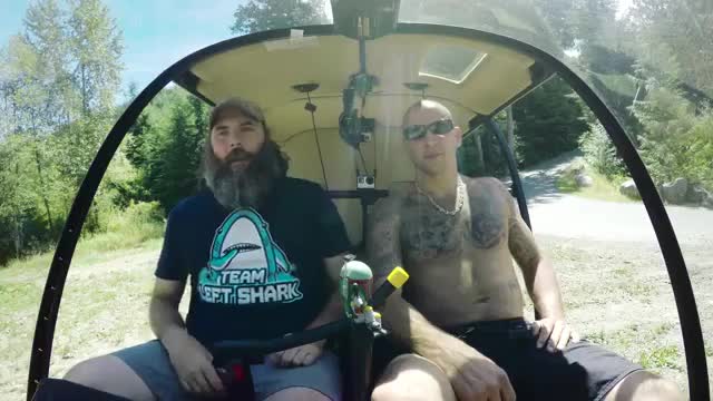 Snowmobile on water, shot from a Helicopter